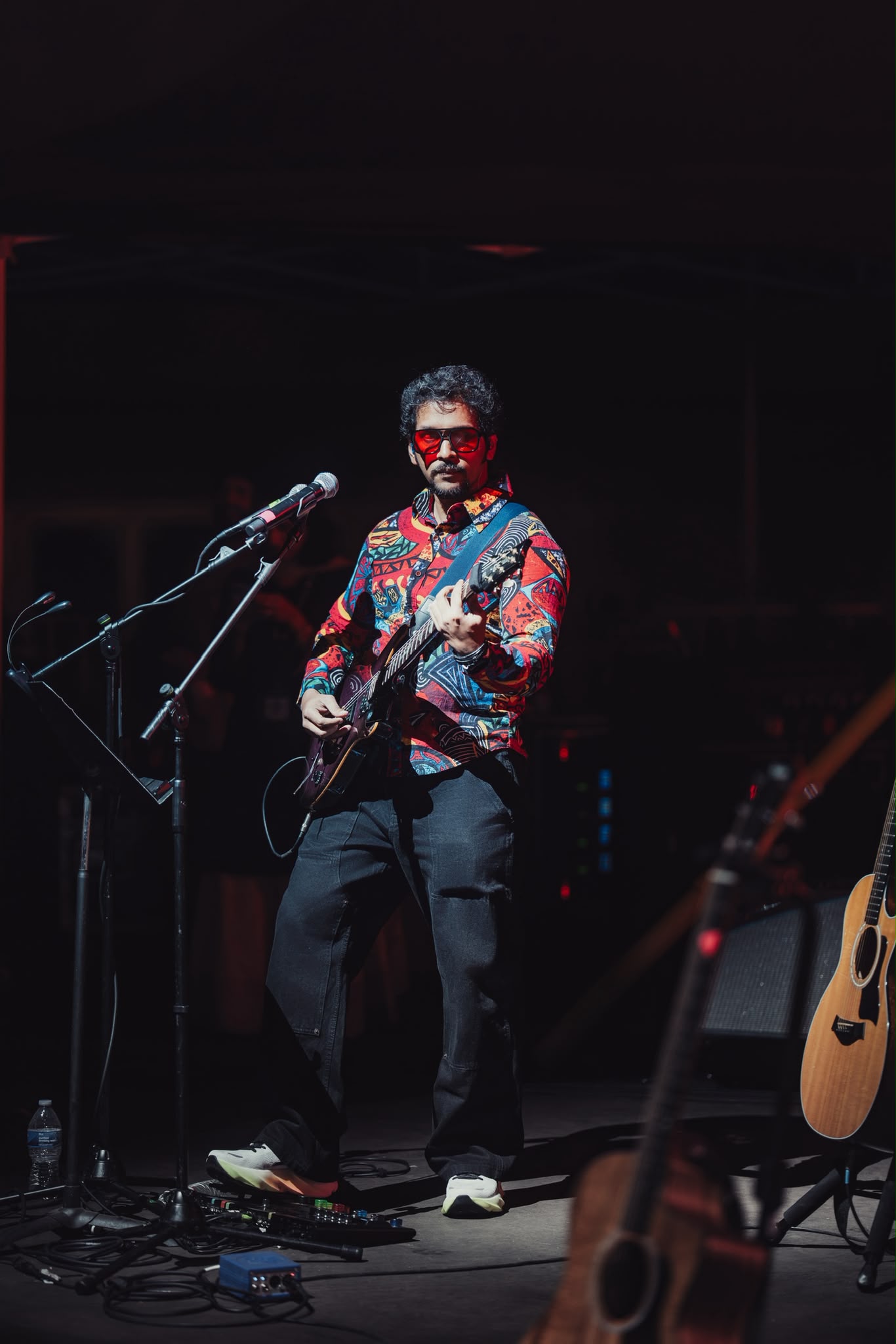 Glen Fernandez performing with electric guitar