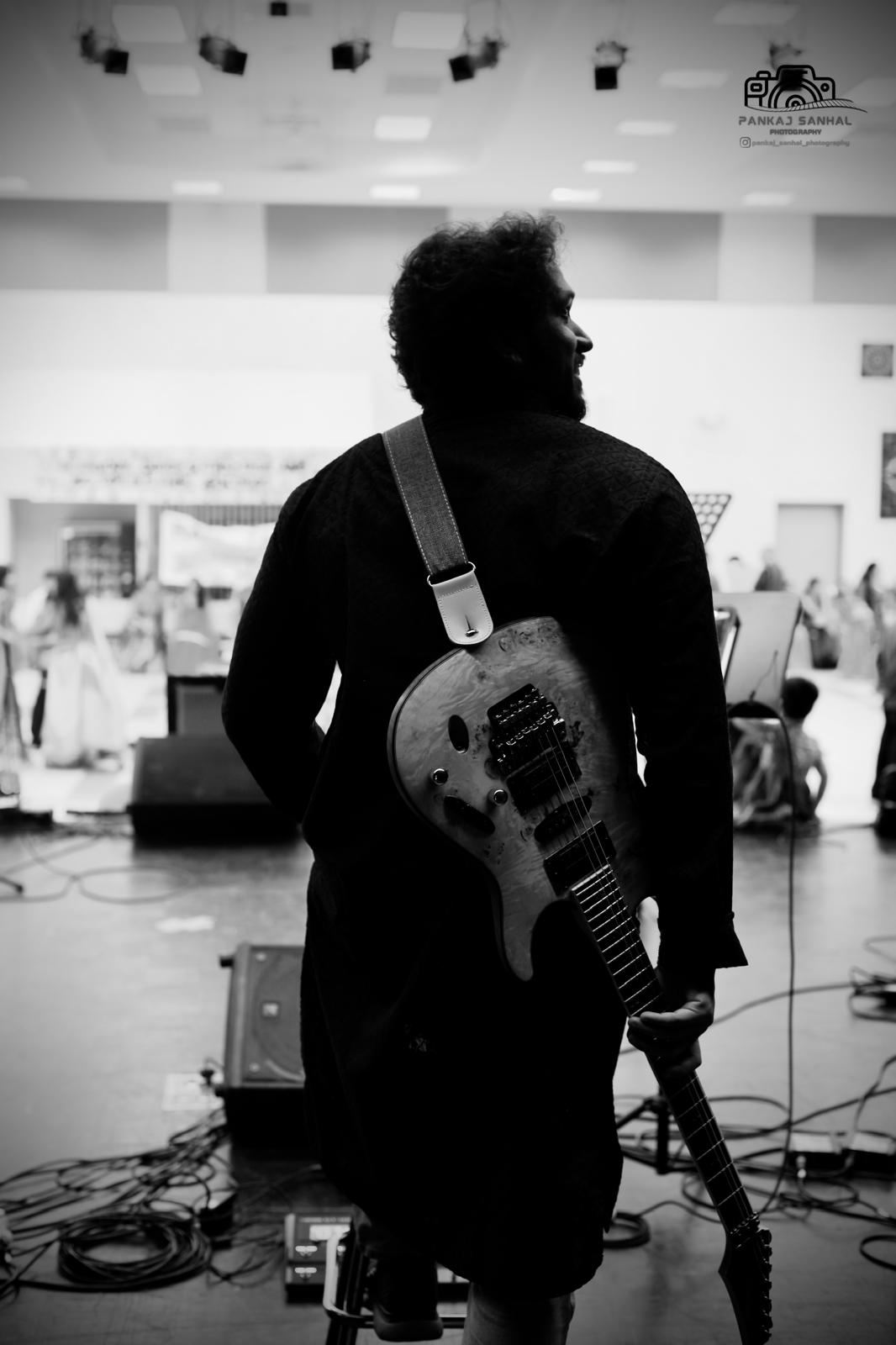 Glen Fernandez playing electric guitar