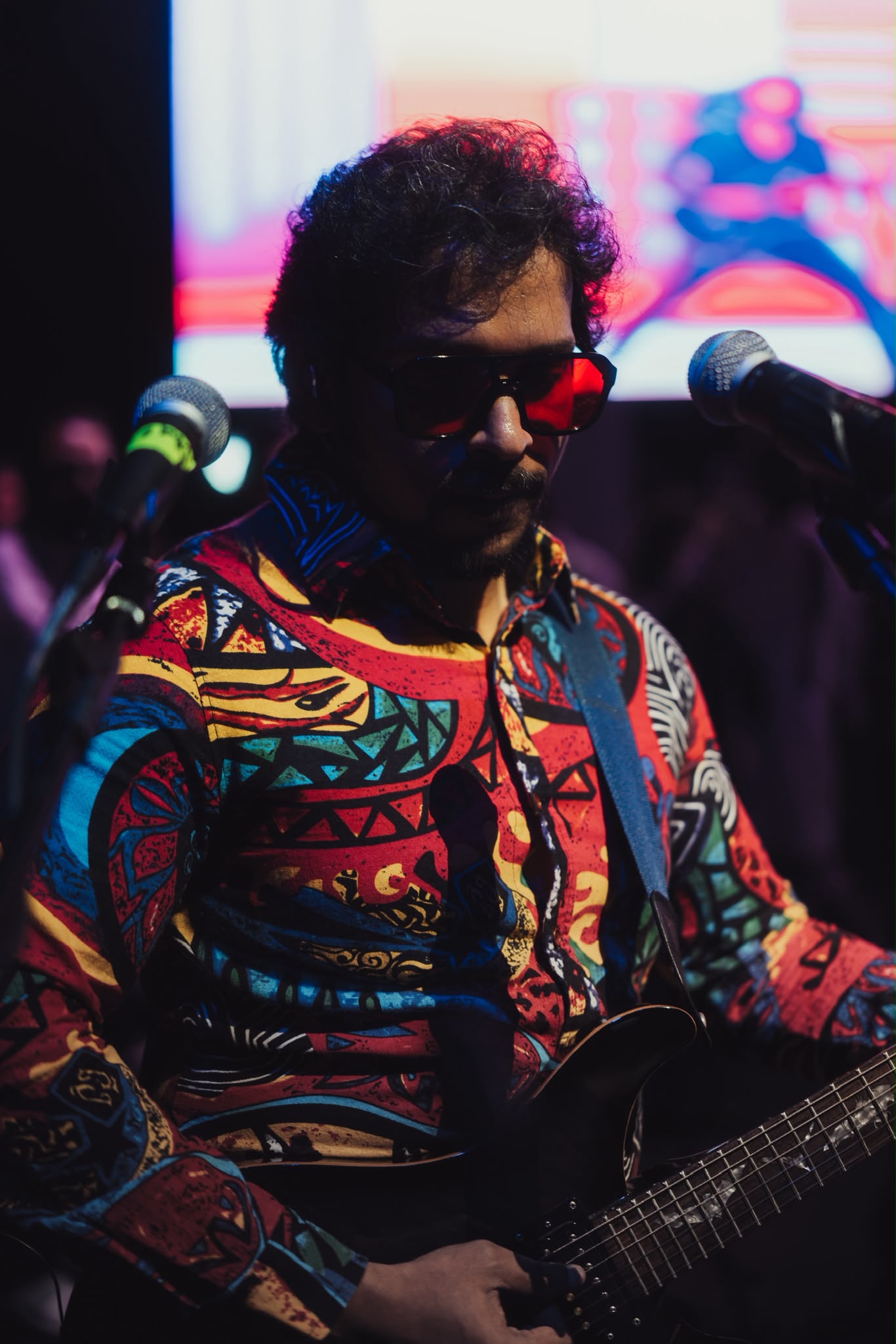 Glen Fernandez performing with acoustic guitar