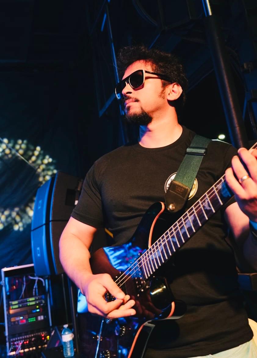 Glen Fernandez performing with electric guitar